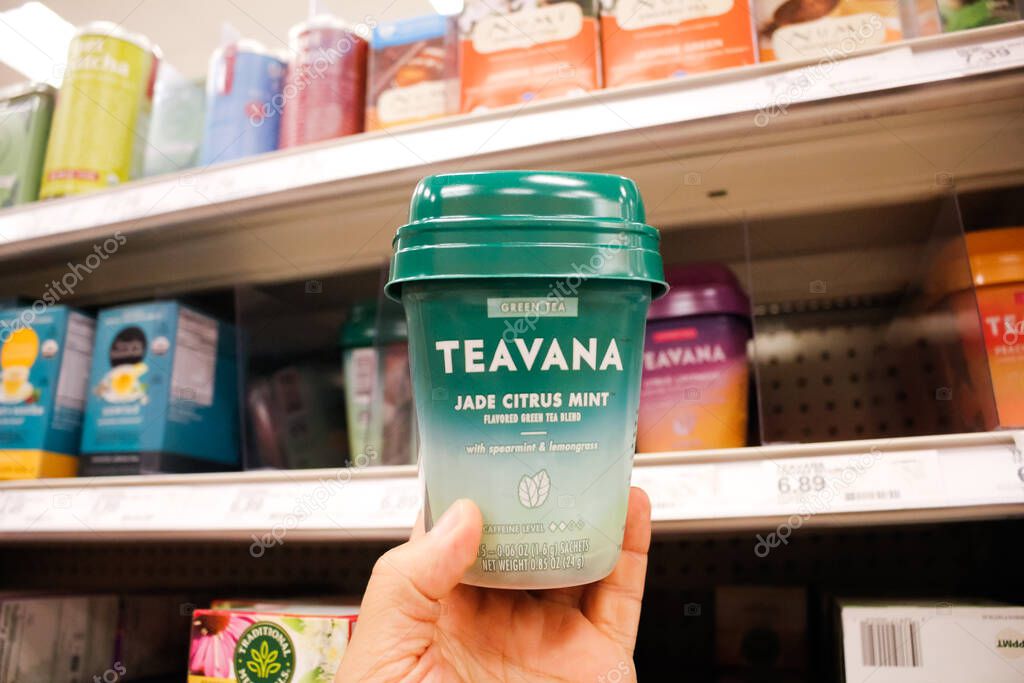 Alhambra, California, United States - 02-19-2020: A hand holds a container of Teavana  tea sachets, on display at a local grocery store.