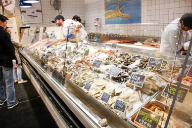 Los Angeles, California, United States - 02-23-2020: A view of clerks helping customers in the seafood department of Eataly.