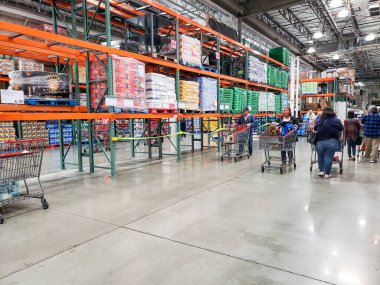 Los Angeles, California, United States - 07-22-2020: A view of shoppers walking around a local Costco store. Many shelf spaces look empty due to products being out of stock.