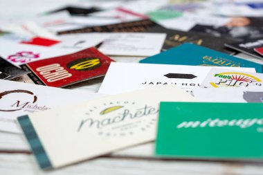 Los Angeles, California/United States - 02/06/2020: A closeup view of a collection of several business cards. 