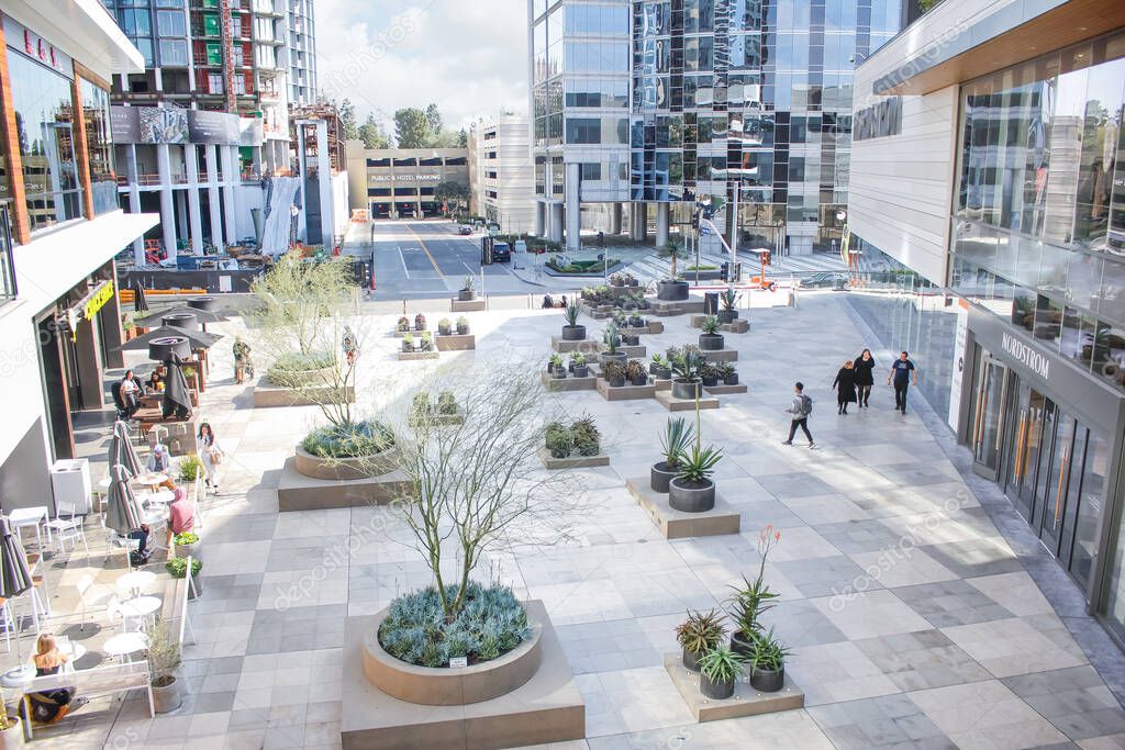 Los Angeles, California, United States - 02-23-2020: A view of a plaza area inside the Westfield Century City, featuring plant landscape and retail shops.