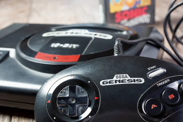 Los Angeles, California, United States - 05-07-2020: A closeup view of a Sega Genesis game console and controller, featuring the Sonic the Hedgehog video game box.