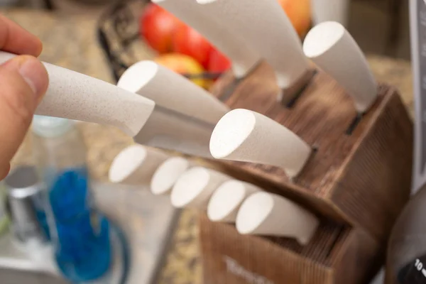 Closeup View Hand Pulling Out Knife Knife Block Kitchen Setting — Stok Foto