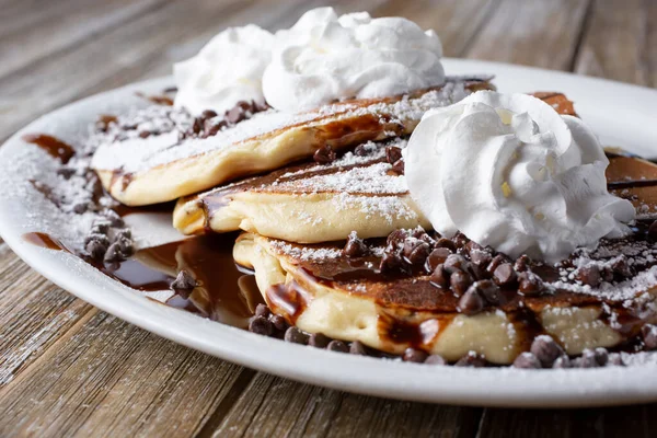 Closeup View Plate Chocolate Chip Pancakes Featuring Whipped Cream Powdered — Stockfoto