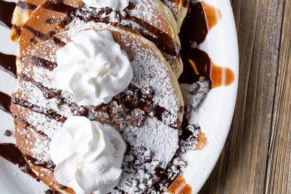 Top View Plate Chocolate Chip Pancakes Whipped Cream Powdered Sugar — Stock fotografie
