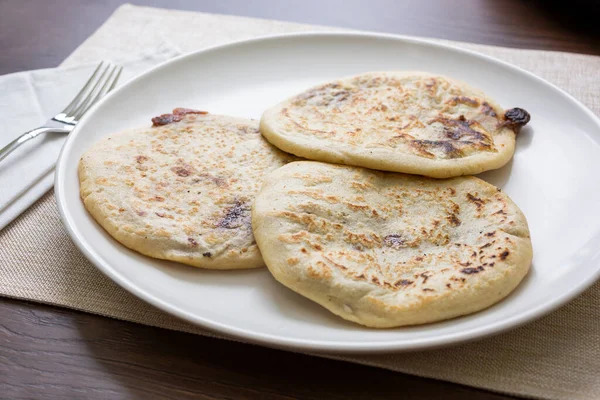 A view of a plate of pupusas.