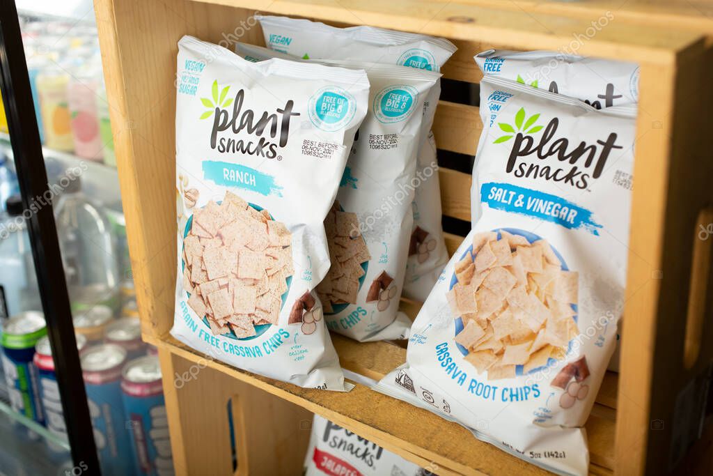Los Angeles, California, United States - 10-25-2021: A view of several bags of Plant Snacks ranch flavor cassava chips, on display at a local convenient store.