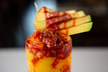 A closeup view of a decorated chamango drink.