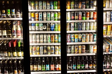 Los Angeles, California, United States - 02-24-2021: A view of a commercial refrigerator with several window doors revealing a wide selection of beer.