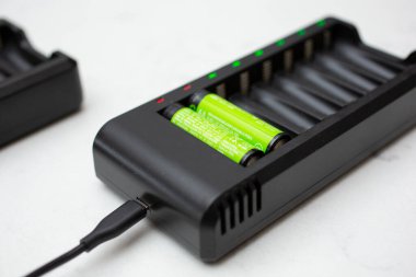 Los Angeles, California, United States - 02-24-2021: A view of two rechargeable batteries in a charging unit.
