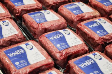 Los Angeles, California/United States - 07/01/2020: A closeup view of several packages of Imperial wagyu ground beef, on display at a local big box grocery store.