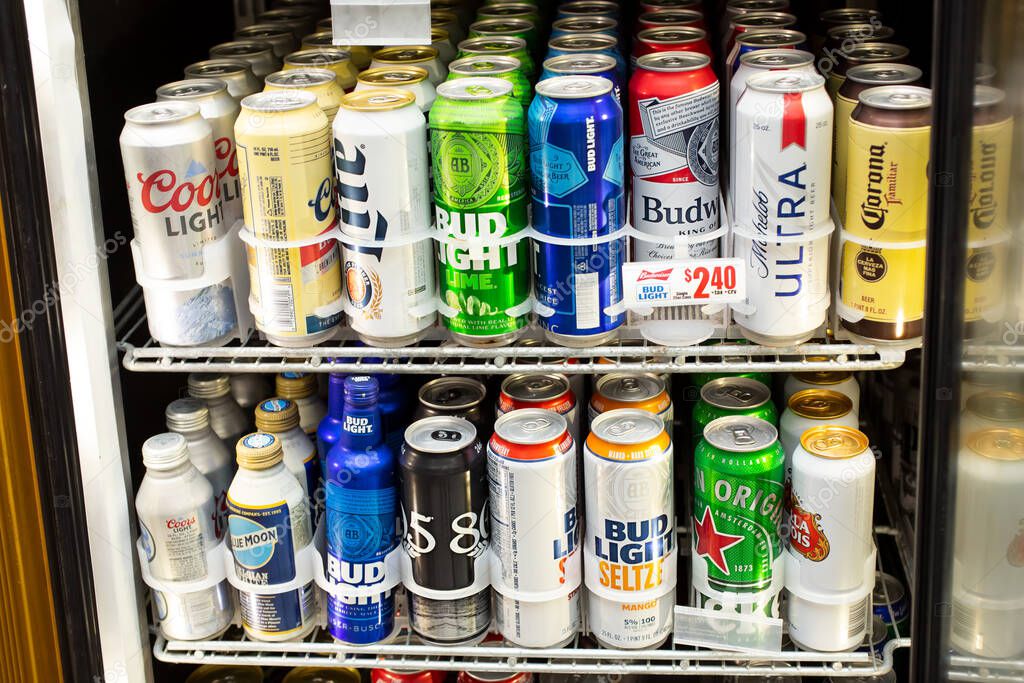 Los Angeles, California, United States - 07-22-2020: A view inside a commercial beverage refrigerator featuring a variety of popular brands of tall beer cans, seen at a local liquor store.