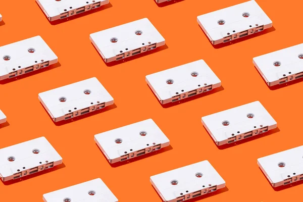 Pattern White Painted Cassette Tapes Orange Background Creative Summer Music —  Fotos de Stock