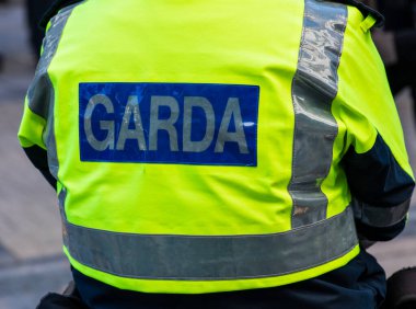 View of police emblems in Ireland, emblem on building, car, and street lantern, Limerick, Ireland,26,02, 2022