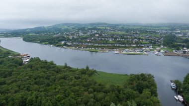 Killaloe, Ireland - July 30, 2022; Small boat floating dock on the River Shannon, and surrounding areas
