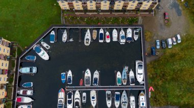 Killaloe, Ireland - July 30, 2022; Small boat floating dock on the River Shannon, and surrounding areas