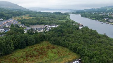 Killaloe, Ireland - July 30, 2022; Small boat floating dock on the River Shannon, and surrounding areas