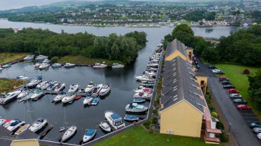 Killaloe, Ireland - July 30, 2022; Small boat floating dock on the River Shannon, and surrounding areas