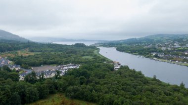 Killaloe, Ireland - July 30, 2022; Small boat floating dock on the River Shannon, and surrounding areas