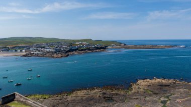 Kilkee town and public beach and surrounding cliffs around the crystal blue Atlantic, Kilkee, Ireland, August,13,2022