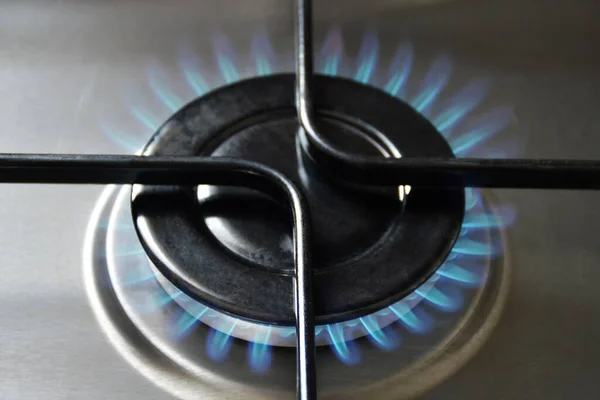 Natural gas burning on kitchen gas stove