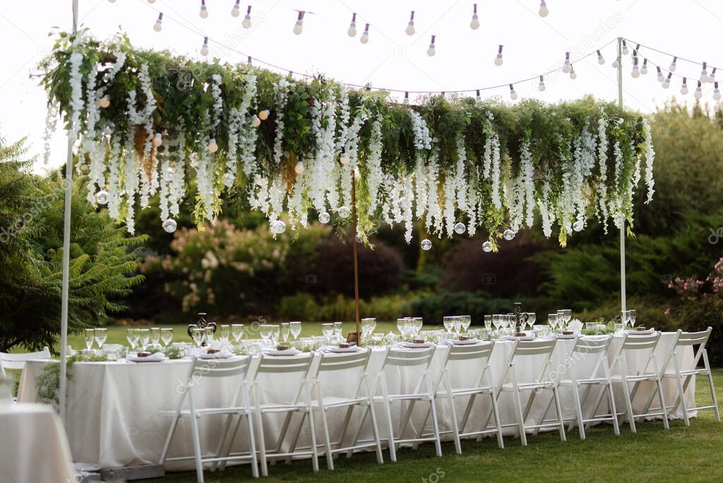 Banquet in the garden for a wedding with decorative elements, atmospheric decor
