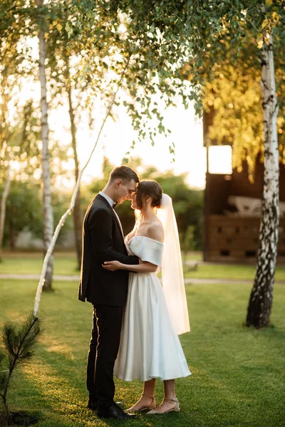 Young Couple Groom Black Suit Bride White Short Dress Walk — Zdjęcie stockowe