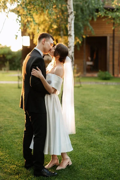 Young Couple Groom Black Suit Bride White Short Dress Walk — Fotografia de Stock