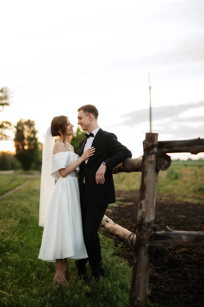 Young Couple Groom Black Suit Bride White Short Dress Walk — Φωτογραφία Αρχείου
