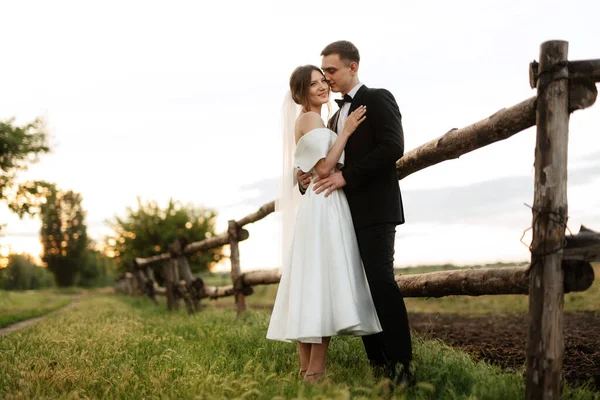 Young Couple Groom Black Suit Bride White Short Dress Walk — Φωτογραφία Αρχείου