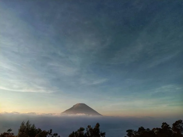 mountain view shrouded in mist in the morning