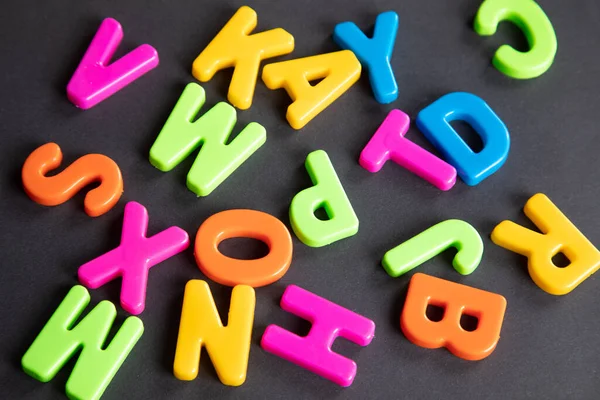 Plastic Letters Scattered Wooden Table — Stock Photo, Image