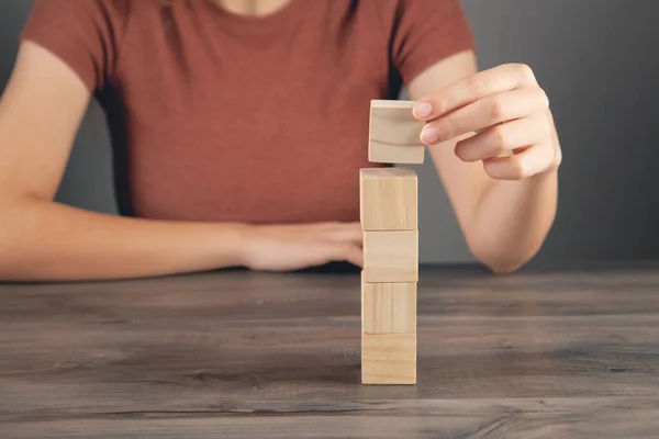 Woman Holding Tower Wooden Cubes — Stock Photo, Image