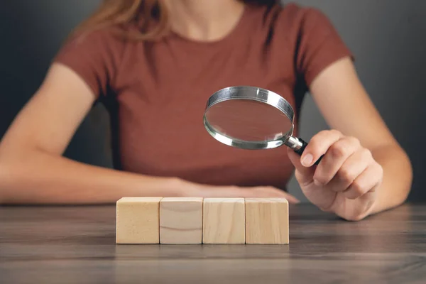 Woman Looking Wooden Cubes Magnifying Glass — Stock Photo, Image