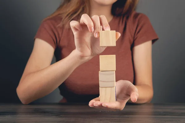 Woman Holding Tower Wooden Cubes — Stock Photo, Image
