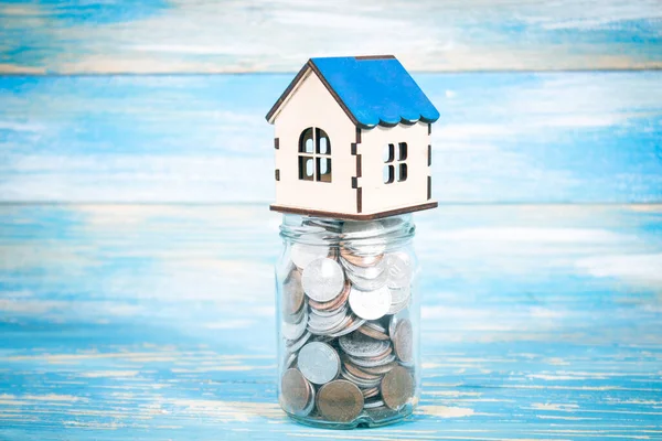 house on a bank with coins