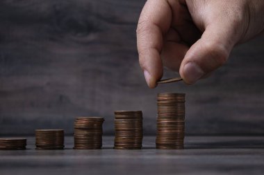 coins on the table. adds on top.