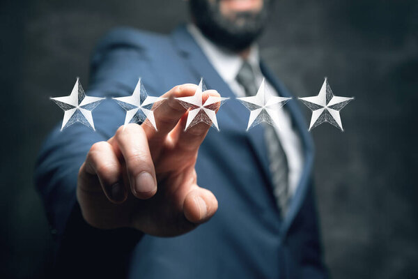 Star rating concept. Stars from the net. Man tapping on the screen