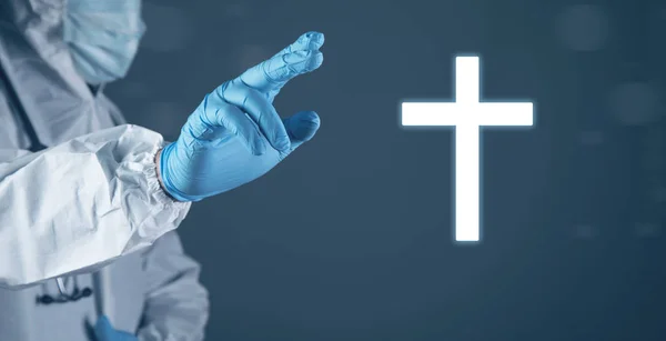 Christian cross icon. The doctor clicks on the screen