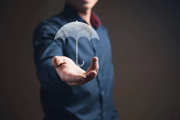 Umbrella from the net. Network protection concept. Man holding in his hand