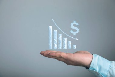 Dolar düşmeye başladı. Ağ grafiği çöker. Elinde tutan adam.