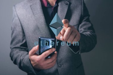 Ethereum virtual currency image. Cryptocurrency. Man tapping on the screen