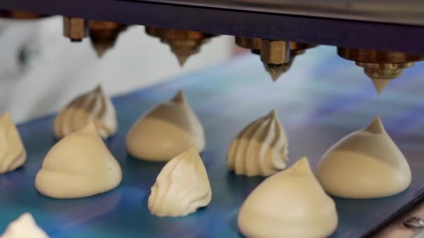 Making sweet meringues on the production line. — Stock Video