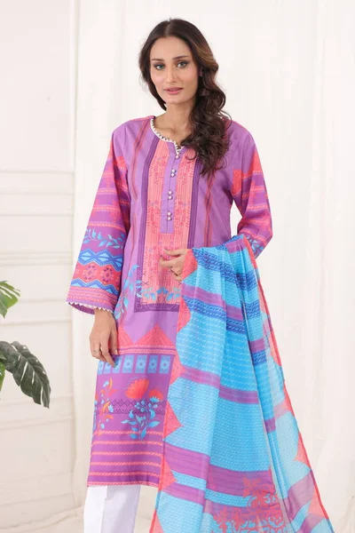 A Pakistani shalwar kameez suit with dupatta. Pakistani model is shown her dress with style.