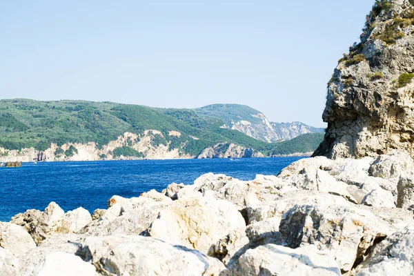 Large Gray Stones Background Blue Sea Water Large Rocks — Stockfoto