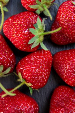 Arka plan olarak lezzetli çileğin yakın görüntüsü