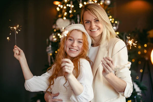 Lesbian Couple Having Dinner Celebrating Holiday Girls Burn Sparklers Smile Stockbild