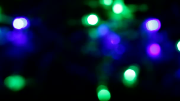 Guirnalda de Navidad bokeh, fondo de brillante brillante movimiento borrosa bokeh — Vídeos de Stock