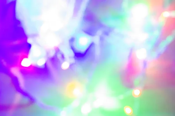 Noel çelengi Bokeh, parlak bulanık Bokeh 'in arka planı, siyah arka planda çok renkli ışıltılar. yumuşak odak.