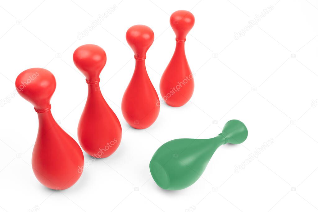 Green skittle lying down in front of four red ones on white background. Manager failure. Bullying other people. Asch conformity study. Struggle of being different.